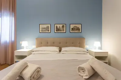 a bedroom with a large bed with towels on it at Don Federico - For Couple in Palermo
