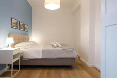 a bedroom with a bed and a desk with a lamp at Don Federico - For Couple in Palermo