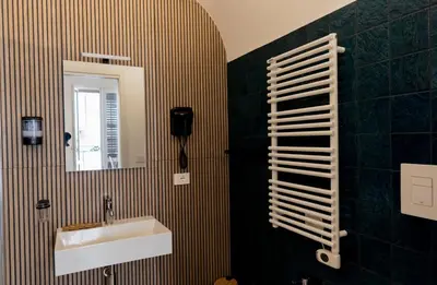 a bathroom with a sink and a mirror at Cielo D'Alcamo Palazzo Oliva in Alcamo