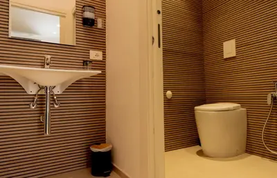 a bathroom with a sink and a toilet at Cielo D'Alcamo Palazzo Oliva in Alcamo