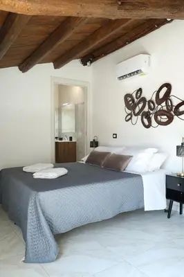 a bedroom with a large bed in a room at Sikelìa Apartment in Carini