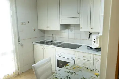 a living room with a couch and a tv at Ampio Appartamento con 3 Camere vicino la stazione - Re D'Aragona Vacanze in Termini Imerese