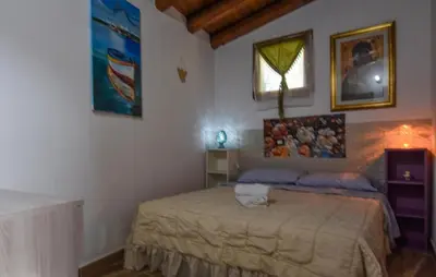 a bedroom with a bed and a window in it at Amazing Home In San Cipirello With Swimming Pool in San Cipirello