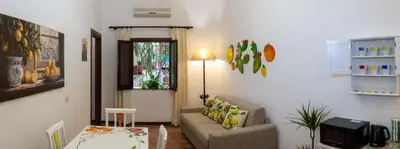 a living room with a couch and a table at La Casa di Orlando Palermo in Palermo