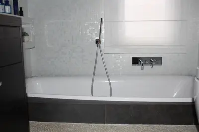 a white bath tub in a bathroom with a sink at Imbriani103 in Cinisi