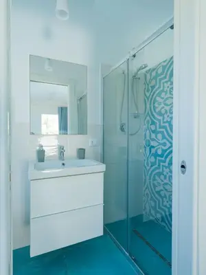 a bathroom with a sink and a shower at Villa Verde Essence in Castellammare del Golfo