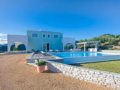 a villa with a swimming pool and a house at Villa Verde Essence in Castellammare del Golfo