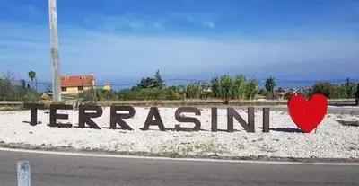a sign with a heart on the side of a road at A casa dei nonni in Terrasini