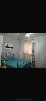 a bedroom with a bed and a ladder in it at La casetta del Maggiore 3 in Palermo