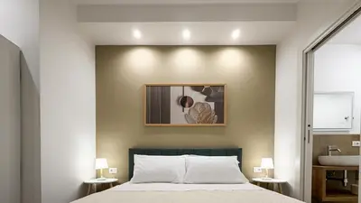 a bedroom with a bed and a sink at Street316 in Cinisi