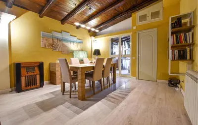 a dining room with yellow walls and a table and chairs at Amazing Home In Monreale in Monreale