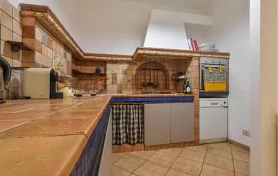 a large kitchen with a counter top and a counter top at Amazing Home In Monreale in Monreale