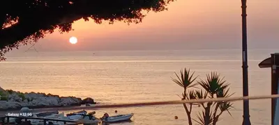 a room with a large window with a view of the ocean at Seahouse Casa vacanze Studiocantieri in Santa Flavia
