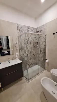 a bathroom with a shower and a sink and a toilet at Siciliano Palace - Deluxe Apartments & Spa in Bagheria
