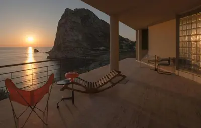 a balcony with chairs and a view of the ocean at Modernist Villa With Private Sea Access in Bagheria
