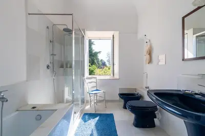 a bathroom with a sink and a toilet and a shower at Baglio del Grillo in Grisi