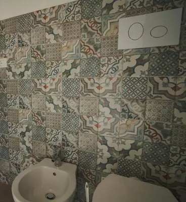 a bathroom with a toilet and a sink at qanatapartment in Palermo