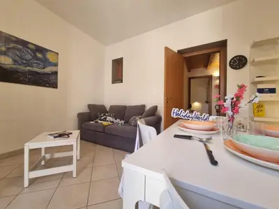 a living room with a couch and a table at DownTown House by Holiday World in Palermo