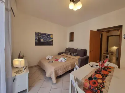 a living room with two beds and a couch at DownTown House by Holiday World in Palermo