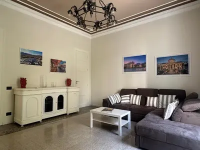 a living room with a couch and a table at Granatelli Apartment in Palermo