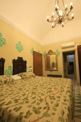 a bathroom with a white sink and a mirror at Trinacria Home in Palermo