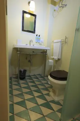 a bathroom with a white sink and a mirror at Trinacria Home in Palermo