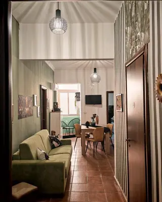 a living room with a couch and a table at Guest House Scalia in Palermo