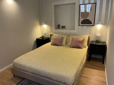 a bedroom with a bed with two pillows on it at Vista Cattedrale - City Center in Palermo