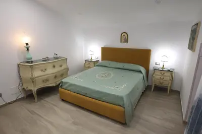 a living room with a yellow couch and a chair at Exclusive Villa with Pool Near Monreale in Monreale