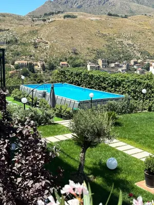 an aerial view of a house with a swimming pool at Exclusive Villa with Pool Near Monreale in Monreale