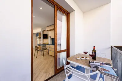 a room with a table and chairs and a dining room at Hotel Calliope in San Vito lo Capo