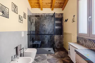 a bathroom with a shower and a toilet and a sink at Verosicily Villa Pomelia in Termini Imerese