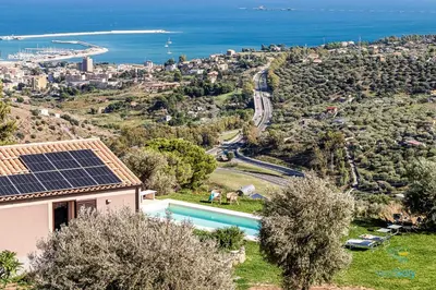 a house with solar panels on top of it at Verosicily Villa Pomelia in Termini Imerese