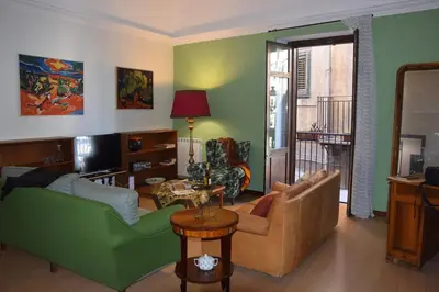 a living room with a couch and a table at Carlita's Home in centro storico a Palermo in Palermo