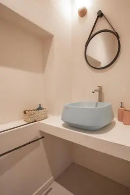 a white bathroom with a toilet and a window at Casa 3 Cupole, Historic Soul and Contemporary Design in Palermo