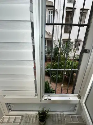 a sliding glass door to a balcony with plants at Isole Siciliane Appartamento in Palermo