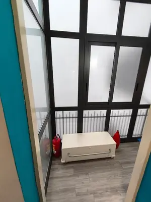 a room with a white bench in front of windows at Central Apartment Cavour in Palermo