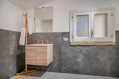 a bathroom with a sink and a mirror at Villa Coraline in Castellammare del Golfo