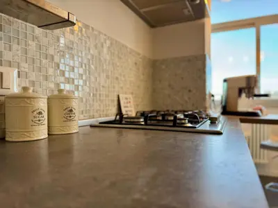 a kitchen with a stove and a counter top at Casa Parlatore in Palermo