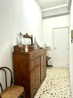 a dressing room with a mirror on a wooden dresser at Da Nonna Marié in Palermo
