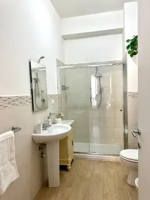 a bathroom with a sink and a shower at Da Nonna Marié in Palermo