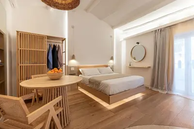 a bedroom with a bed and a table and a mirror at Meraki Home - Alle Spalle del Teatro Massimo in Palermo