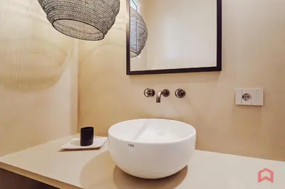 a bathroom with a white bowl sink on a counter at Strepitosa Villa Vista Mare con Piscina Privata in Terrasini