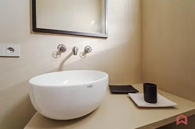 a bathroom with a white sink on a counter at Strepitosa Villa Vista Mare con Piscina Privata in Terrasini