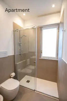 a bathroom with a shower and a toilet at Accordi al Politeama in Palermo