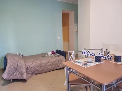 a living room with a couch and a table at Pruni's Home by Holiday World in Palermo