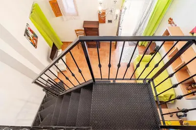 an overhead view of a staircase in a house at La petite Bastet in Palermo
