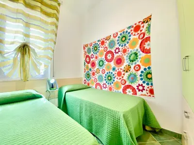an outdoor patio with chairs and a table at Villa Per Sole Mare e Relax, 200 mt dalla spiaggia in Alcamo