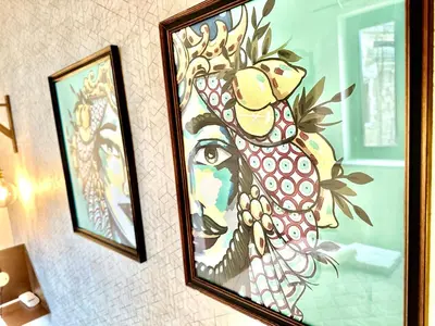 a painting of a chicken hanging on a wall at Via del Bosco Home in Palermo