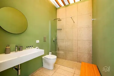a bathroom with a shower and a toilet and a sink at Villa Ametista in Alcamo
